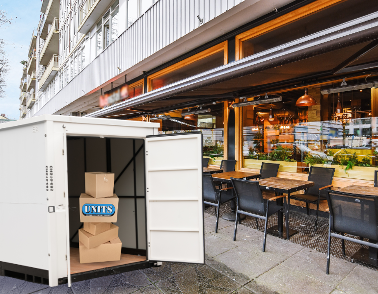 units container in front of a restaurant pic
