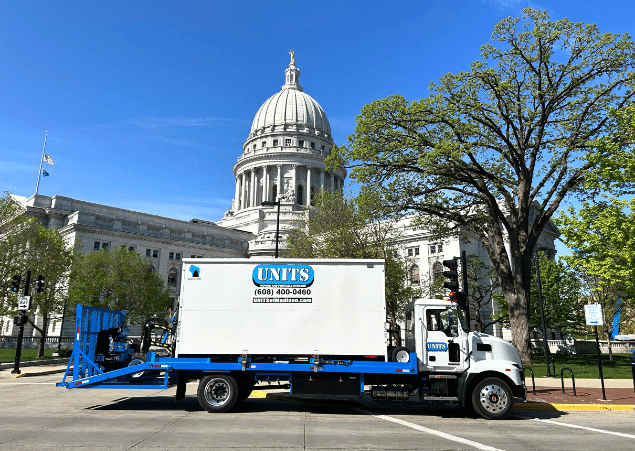 Madison capitol with a portable storage UNIT container outside of it.
