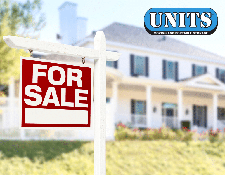 realtor storage solutions - a for sale sign in front of a white home