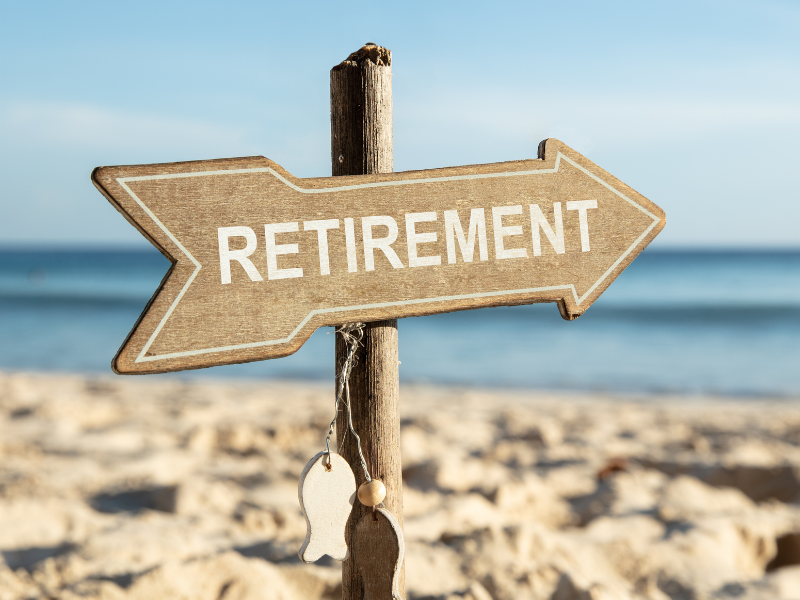 Retirement sign in the sand at the beach