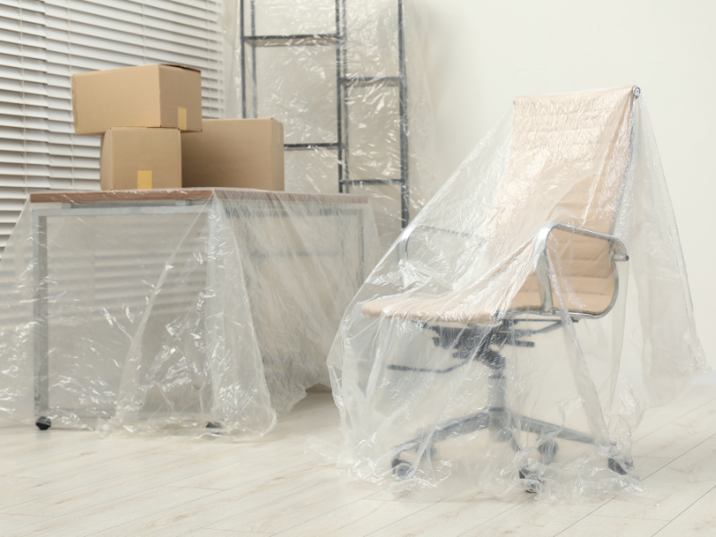 furniture covered in plastic when Moving in Bad Weather