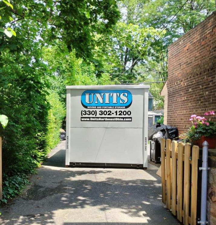 A Units Of Northeast Ohio container sitting in a driveway.