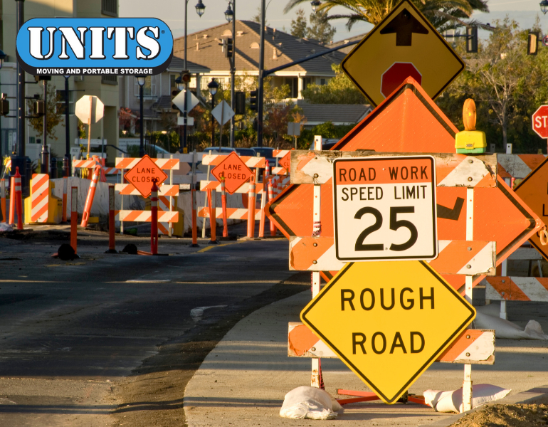 a pic of roadway construction signs and units logo
