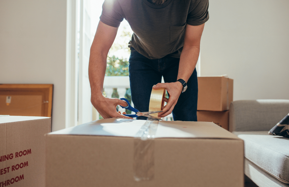 Units of Omaha & Lincoln man packing box for new home