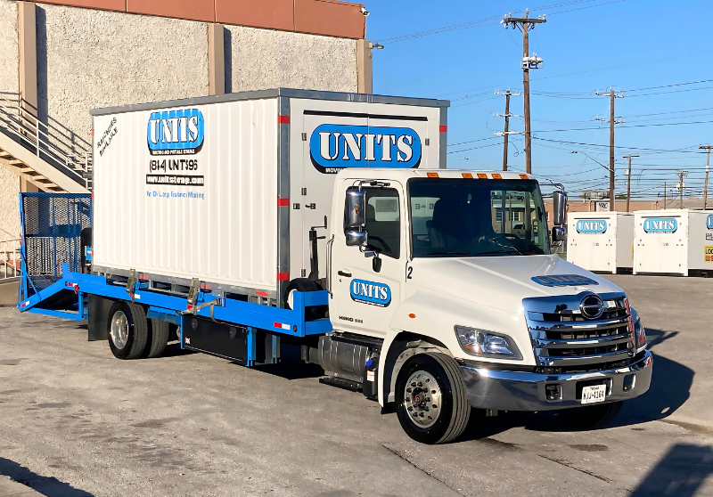 UNITS of San Diego portable storage delivery truck with portable storage container on the truck.