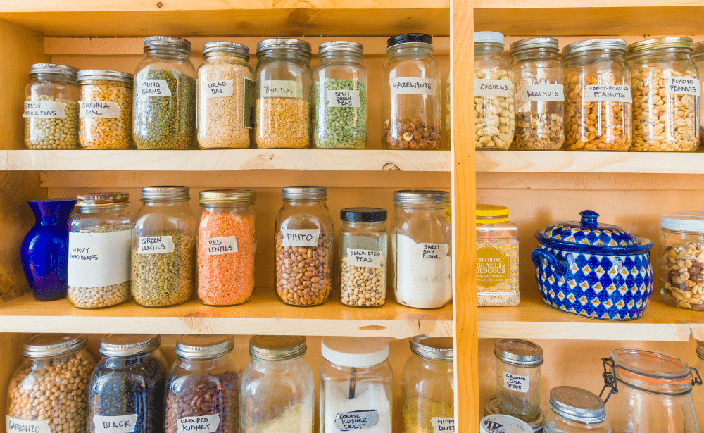 Pantry shelf filled jars and containers.