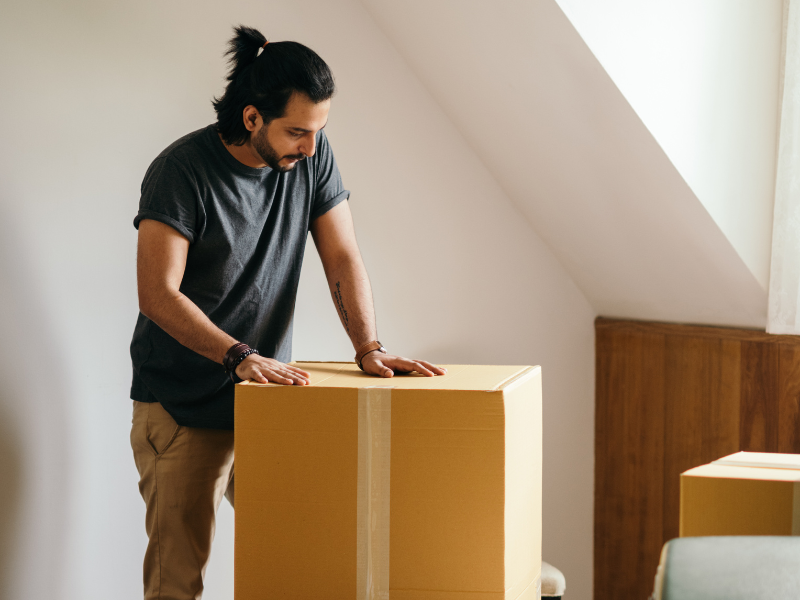 man packing for his fall move